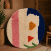 Round Azilal rug with blue and pink abstract design in Moroccan interior